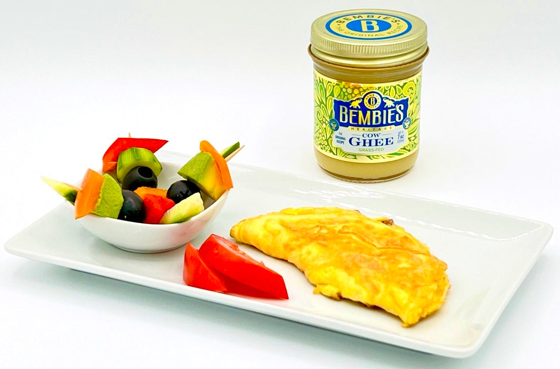 Fluffy ham omelette cooked with Bembie’s Grass-Fed Ghee, a protein-rich and Keto-friendly breakfast option.