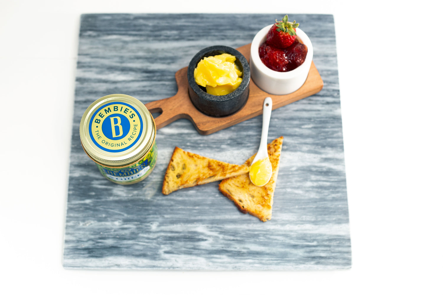 Bembie's Ghee spread on a pita bread with strawberry jam.